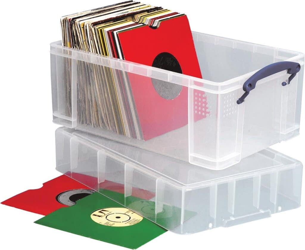 Plastic box containing vinyl records in colorful sleeves.