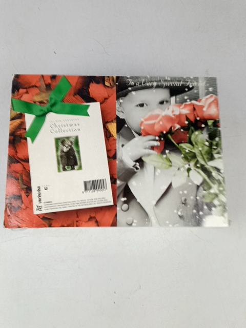Child with Flowers and a Christmas Card