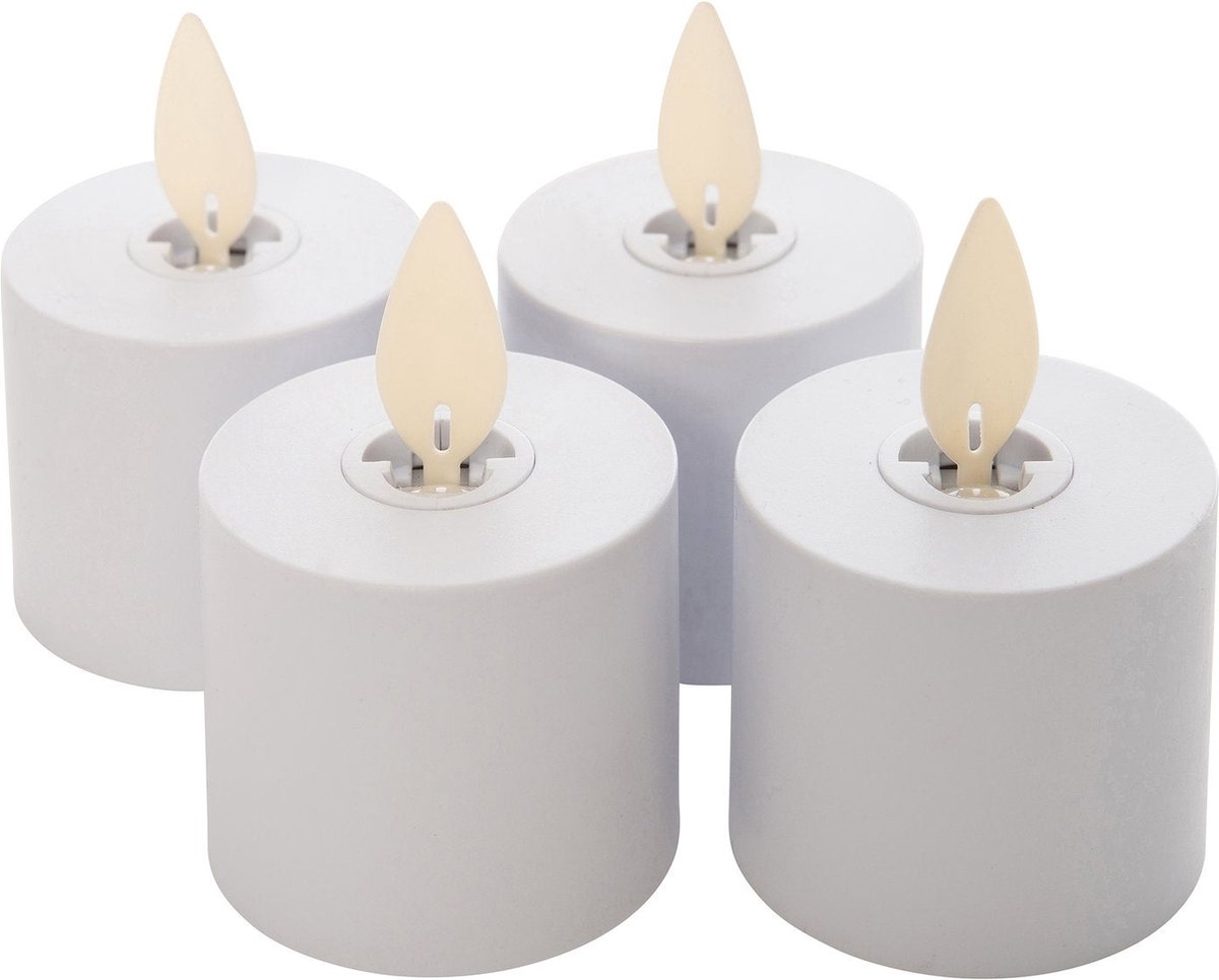 Four LED candles with flame-shaped wicks