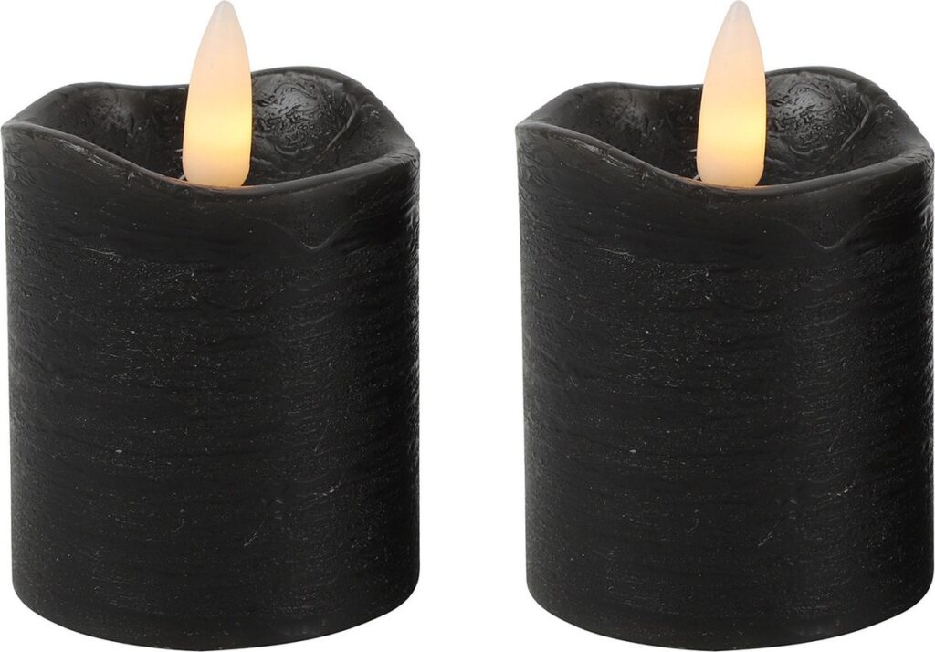 Two black LED pillar candles with flickering flames
